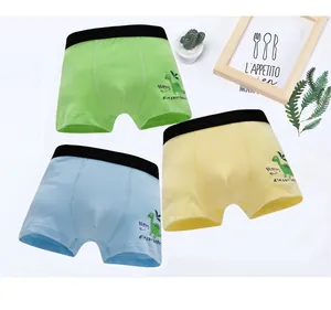 Detailed view of three cotton boys boxers with dinosaur prints and elastic waistbands
