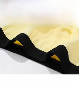 Close-up of wide elastic waistband and soft yellow cotton fabric on boys boxers