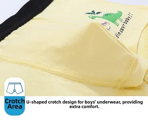 Detail of boys' yellow cotton boxer briefs with U-shaped pouch and dinosaur print