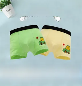 Detail of soft cotton kids boxers featuring cute car prints and elastic waistband