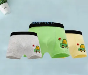 Three pairs of cotton boy's boxer briefs in grey, green, and yellow with car prints