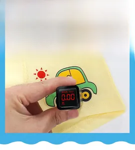 Detail showing fluorescence test on cotton fabric with cartoon car print for kids