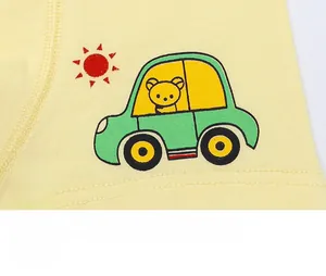 Detail showing eco-friendly cartoon car print on yellow soft cotton boys boxer shorts