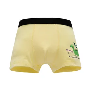 Boys' cotton boxer briefs in yellow with a green dinosaur print and elastic waistband