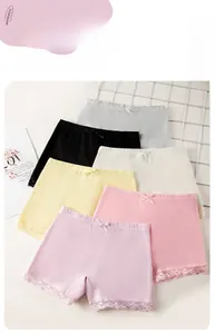 Close-up of girls' safety shorts featuring delicate lace trim and cute bow detailing