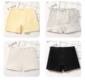 Détail de culottes de sécurité en coton pour filles avec petits nœuds en quatre coloris