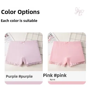 Detail of girls' cotton safety shorts in pink and purple with lace trim and bows