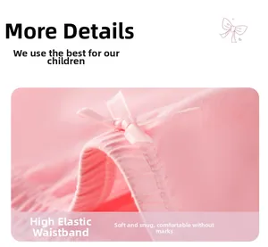 Detailed view of pink cotton girls' shorts with elastic ribbed waistband and bow