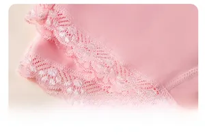 Detailed macro view of pink cotton fabric with delicate floral lace hem on leg opening