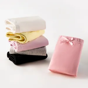 Set of five pure cotton girls' safety shorts in various colors with bow detail