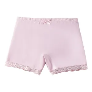 Pink cotton girls' safety shorts with elastic waist, lace trim, and bow detail