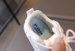 Detail view of breathable blue mesh insole with shock absorption for baby sneakers