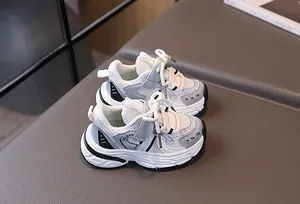 Detail view of children's mesh sneakers showing breathable fabric and Velcro strap