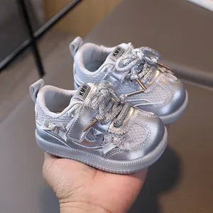 Silver baby girls sneakers with glitter laces, bow accent and white rubber sole