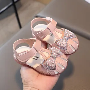 Pink toddler girl sandals with hollow design, large bow, pearls and rhinestones decoration