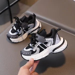 Kids breathable mesh sneakers with chunky soles and tricolor black white grey design