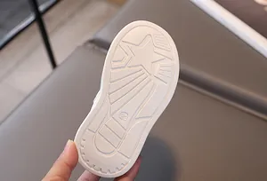 Detailed view of white anti-slip rubber sole with star pattern and size 23 engraving