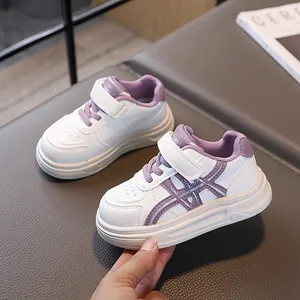 Kids white and purple casual sneakers with velcro strap and chunky comfortable sole