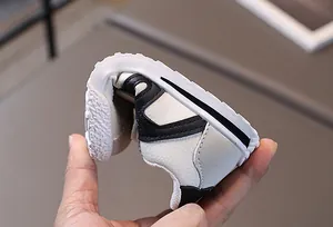 Detail shot showing the high flexibility and soft leather texture of kids' sneakers
