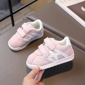 Pink and white toddler sneakers with non-slip rubber soles and double velcro straps