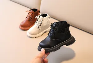 Three colors of kids martin boots in black, beige and brown with anti-slip thick rubber soles