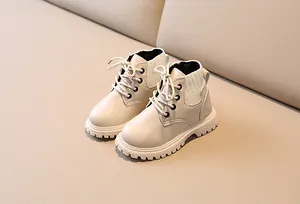 Detail view of children British style lace-up boots with non-slip thick rubber soles
