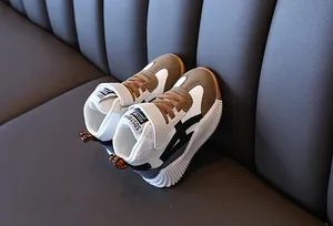Detail view of children's high-top sneaker with non-slip rubber sole and velcro strap