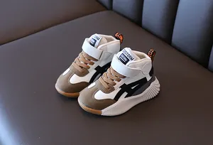Detailed side view of kids mid-top sneakers with non-slip wavy sole and velcro strap