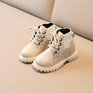Beige children's British style Martin boots with thick rubber soles and knit collars