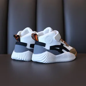 Kids high-top sneakers in white and grey with velcro closure and thick anti-slip sole