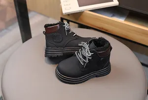 Detail view of children's winter boots with warm plush lining and thick anti-slip rubber sole