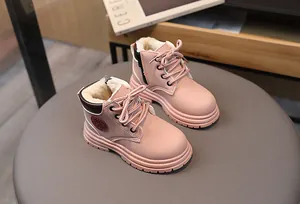 Detail of pink children's snow boots with plush faux wool lining and non-slip rubber sole