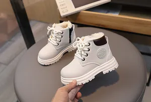 Detail of warm winter kid boots with thick faux fleece lining and side zipper