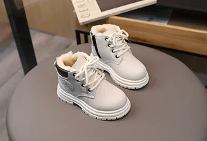 Detail view of cream winter boots for kids featuring warm plush lining and zipper