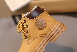 Close-up of kids winter boots with warm faux fur lining and anti-slip rubber sole