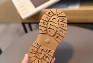 Detailed view of durable anti-slip rubber outsole for children's winter snow boots
