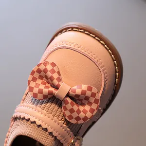 Chaussures de marche roses pour bébés filles avec nœud en damier et cuir souple