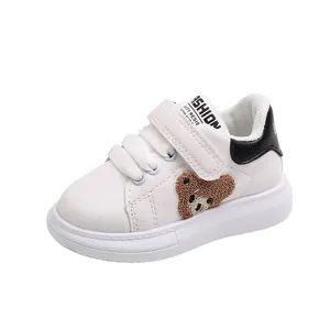 Cute white kids sneakers featuring a 3D plush bear patch and non-slip rubber soles