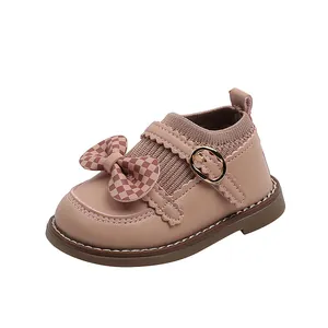 Chaussures bébé fille roses avec nœud à carreaux et semelle souple en gomme
