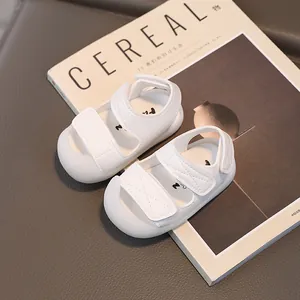 White baby sandals with double velcro straps and closed-toe anti-collision design