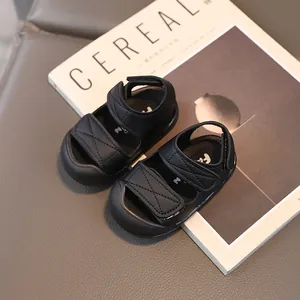 Classic black baby closed-toe sandals with adjustable hook-and-loop straps and soft soles