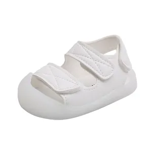 White baby sandals with double hook and loop straps and closed toe for toddlers