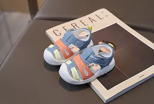 Detail of toddler closed-toe sandals with velcro straps and anti-slip rubber soles
