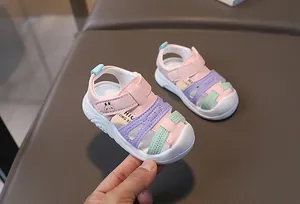 Close-up of pink and purple toddler sandals featuring a protective closed-toe and bunny detail