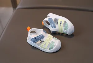 Detail view of toddler closed-toe sandals with colorful straps and anti-slip sole
