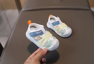 Detail view of baby closed-toe sandals featuring colorful patchwork and non-slip soft soles