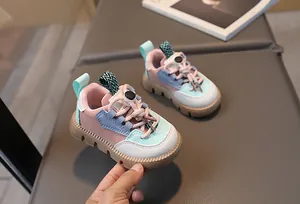 Close-up of colorful mesh panel sneakers with thick non-slip brown rubber soles