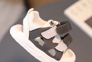 Detail view of children's mesh sandals with double velcro straps and anti-collision toe