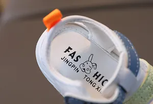 Detail of baby sandal featuring soft inner sole with rabbit logo and fashion lettering