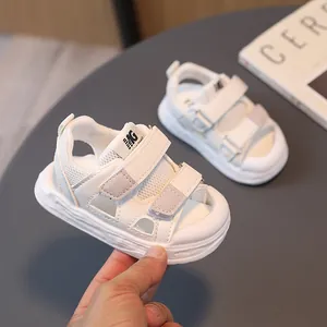 Breathable white children's closed-toe sport sandals with gray suede and Velcro straps